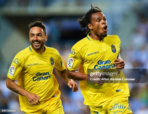 Logic Remy of Union Deportiva Las Palmas celebrates after scoring with during the La Liga match between Malaga and Las Palmas at Estadio La Rosaleda...