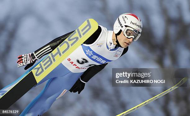 Switzerland's Simon Ammann soars in the air during the 18th leg World Cup Ski Jumping competition in Sapporo on January 31, 2009. The 19th leg of the...