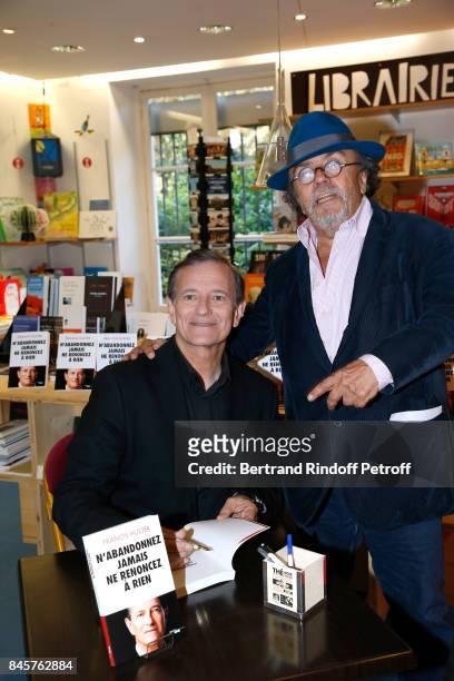 Actor Francis Huster and Director of the "Theatre du Rond-Point" Jean-Michel Ribes attend Francis Huster signs his Book "N'abandonnez jamais, ne...