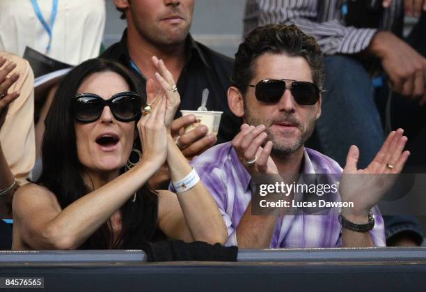 Rebecca Gleeson and Eric Bana attend the men's final match between Rafael Nadal of Spain and Roger Federer of Switzerland during day fourteen of the...