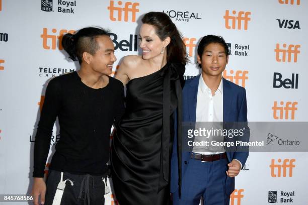 Maddox Jolie-Pitt, Angelina Jolie and Pax Jolie-Pitt attend the "First They Killed My Father" premiere during the 2017 Toronto International Film...