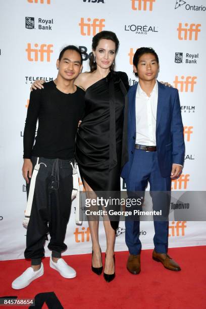 Maddox Jolie-Pitt, Angelina Jolie and Pax Jolie-Pitt attend the "First They Killed My Father" premiere during the 2017 Toronto International Film...