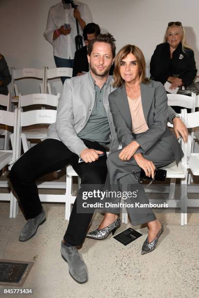 Derek Blasberg and Carine Roitfeld attend Oscar De La Renta fashion show during New York Fashion Week on September 11, 2017 in New York City.