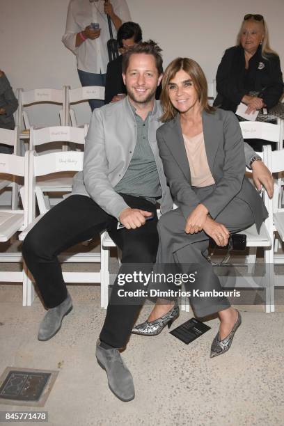 Derek Blasberg and Carine Roitfeld attend Oscar De La Renta fashion show during New York Fashion Week on September 11, 2017 in New York City.