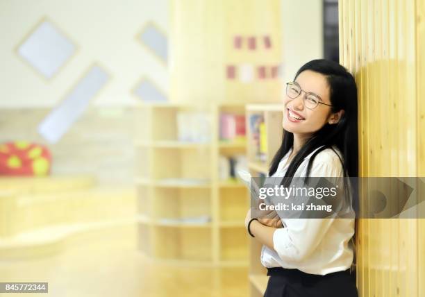 portrait of smiling woman - teacher looking at camera stock pictures, royalty-free photos & images