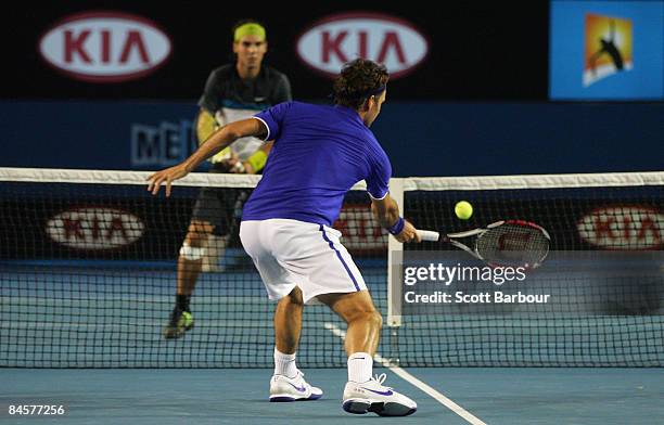 Roger Federer of Switzerland plays a forehand in his men's final match against Rafael Nadal of Spain during day fourteen of the 2009 Australian Open...