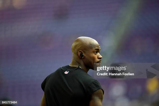 Adrian Peterson of the New Orleans Saints warms up before the game against the Minnesota Vikings on September 11, 2017 at U.S. Bank Stadium in...