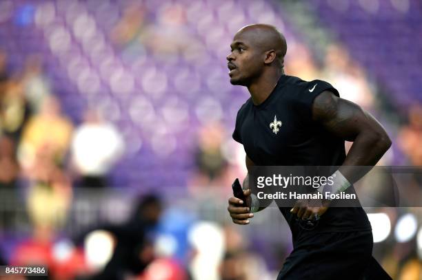 Adrian Peterson of the New Orleans Saints warms up before the game against the Minnesota Vikings on September 11, 2017 at U.S. Bank Stadium in...