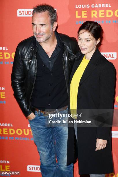 Actor Jean Dujardin and Nathalie Pechalat attend "Le Redoutable" Paris Premiere at Cinema du Pantheon on September 11, 2017 in Paris, France.