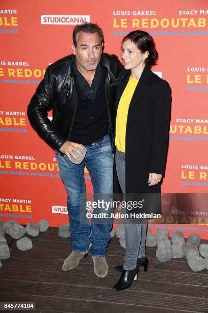Actor Jean Dujardin and Nathalie Pechalat attend "Le Redoutable" Paris Premiere at Cinema du Pantheon on September 11, 2017 in Paris, France.