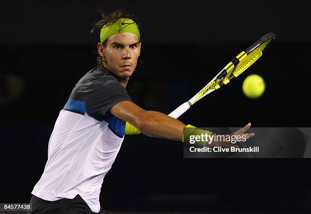 Rafael Nadal of Spain plays a forehand in his men's final match against Roger Federer of Switzerland during day fourteen of the 2009 Australian Open...