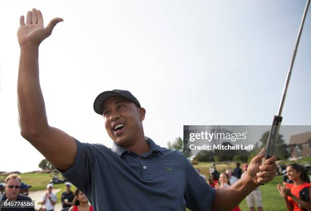 Former NBA player John Starks reacts after making the tournament winning putt during the Julius Erving Golf Classic at The ACE Club on September 11,...