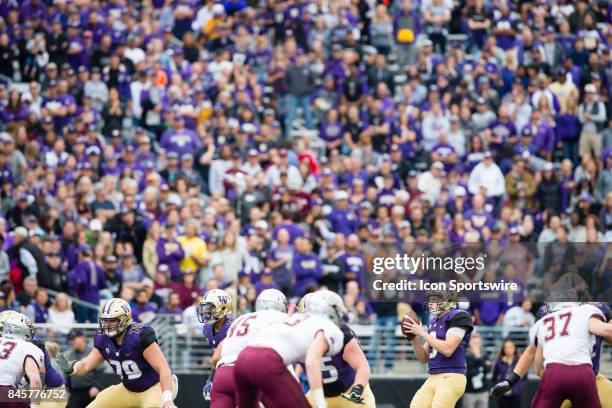 Washington Jake Browning drops back for a pass in the first quarter during a college football game between the Washington Huskies and the Montana...