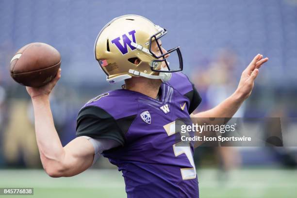 Washington Jake Browning warms up his arm before a college football game between the Washington Huskies and the Montana Grizzlies on September 9,...