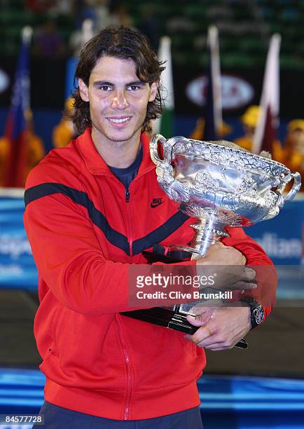 Rafael Nadal of Spain poses with the Norman Brookes Challenge Cup after winning his men's final match against Roger Federer of Switzerland during day...
