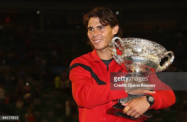 Rafael Nadal of Spain poses with the Norman Brookes Challenge Cup after winning his men's final match against Roger Federer of Switzerland during day...