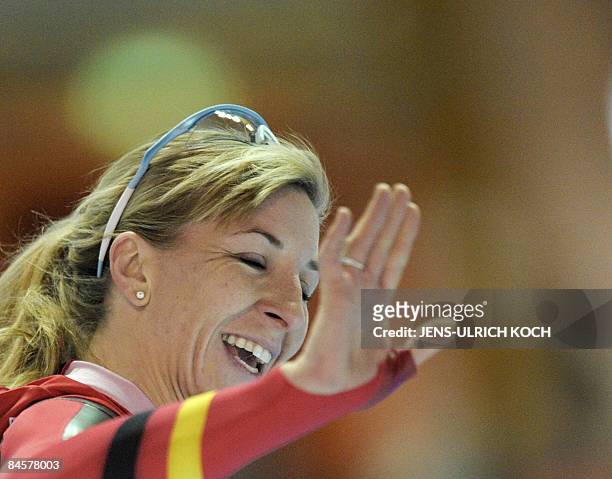German skater Anni Friesinger celebrates winning the women's 1000m race at the ISU Speed Skating World Cup on February 1, 2009 in the eastern German...