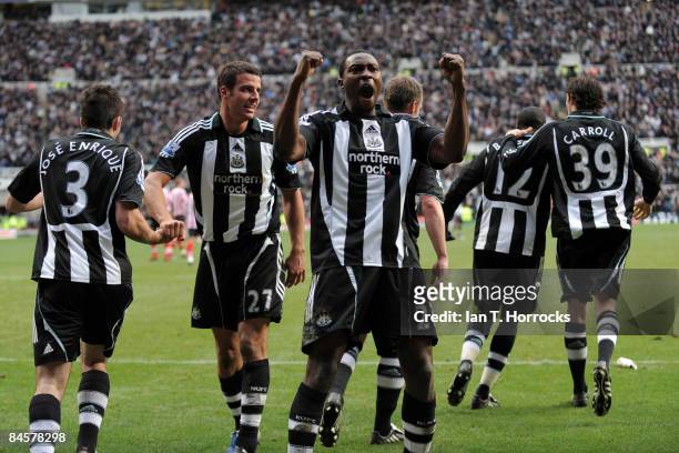 Shola Ameobi of Newcastle United celebrates after scoring from the penalty spot during the Barclays Premier League match between Newcastle United and...