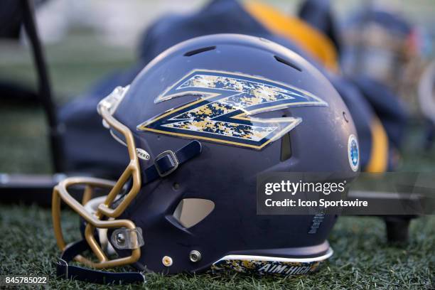 An Akron Zips helmet sits on the sideline during the first quarter of the college football game between the Arkansas-Pine Bluff Golden Lions and...