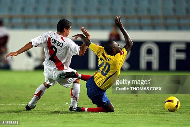 Colombia's midfielder Segundo Victor Ibarbo is tackled by Peru's defender Aldo Corzo during their U-20 South American Championship football match on...