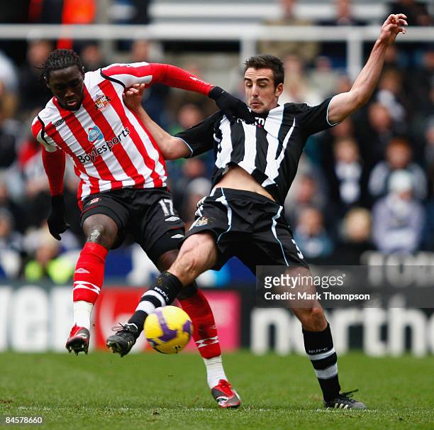 Jose Enrique of Newcastle tangles with of KewyneJones Sunderland during the Barclays Premier League match between Newcastle United and Sunderland at...