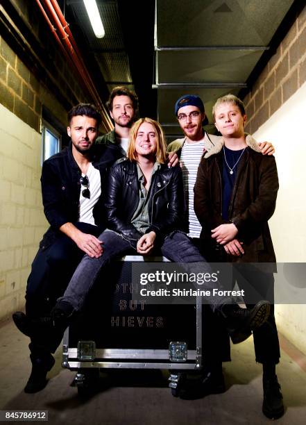 Conor Mason, Joe Langridge-Brown, Dominic Craik, Philip Blake and James Price of Nothing But Thieves pose backstage after performing live and signing...