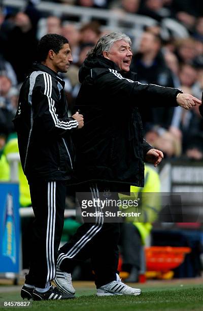 Newcastle manager Joe Kinnear makes a point whilst coach Chris Hughton looks on during the Barclays Premier League match between Newcastle United and...
