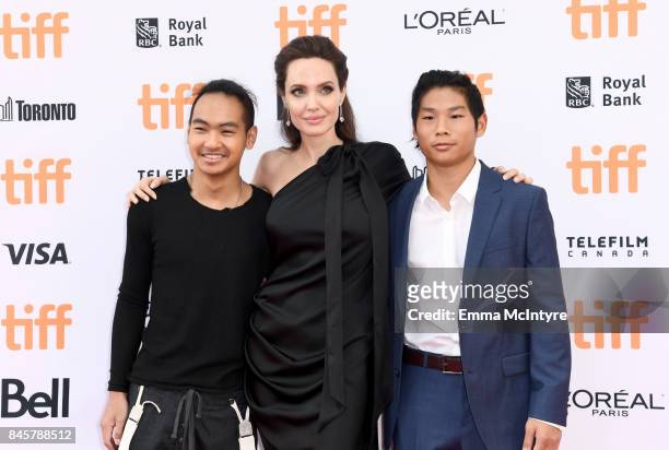 Maddox Jolie-Pitt, Angelina Jolie, and Pax Jolie-Pitt attend the World Premiere of Netflix's Film's "First They Killed My Father" during the Toronto...