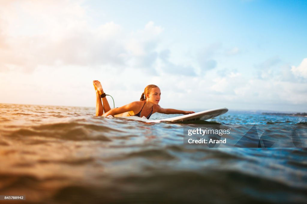 Young surfer woman