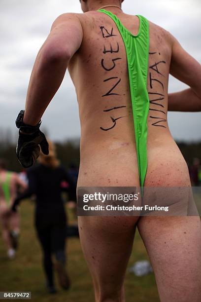 Competitor wearing a 'mankini' braves the cold while running during the Tough Guy Challenge 2009 at South Perton Farm on February 1, 2009 in...