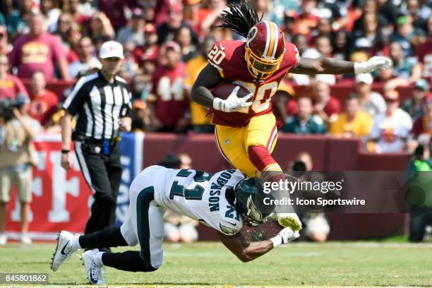 Washington Redskins running back Rob Kelley is brought down by Philadelphia Eagles defensive back Patrick Robinson on September 10 at FedEx Field in...