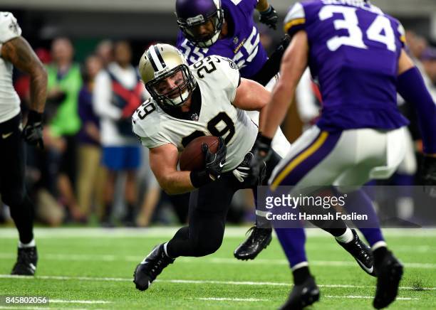 John Kuhn of the New Orleans Saints stumbles with the ball in the first half of the game against the Minnesota Vikings on September 11, 2017 at U.S....