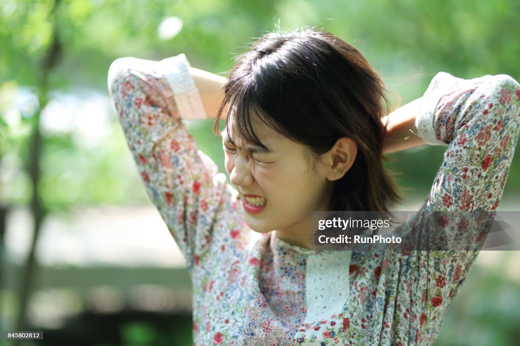 Woman with a heady expression
