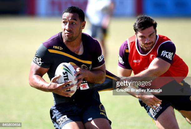 Tautau Moga attempts to break away from the defence during a Brisbane Broncos NRL training session on September 12, 2017 in Brisbane, Australia.