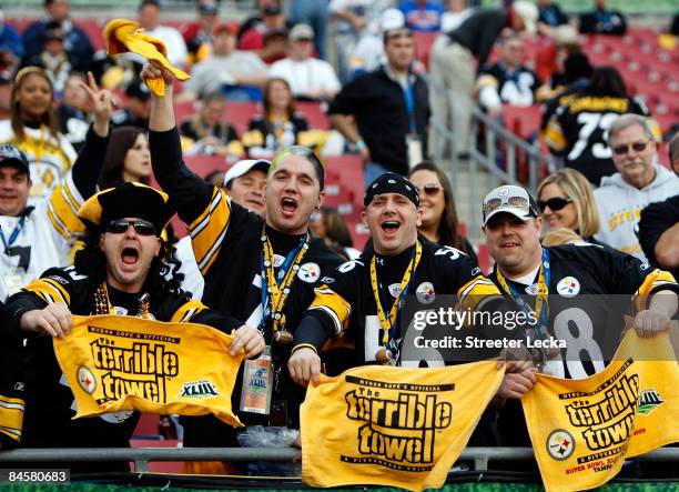 Fans of the Pittsburgh Steelers wave their terrible towels against the Arizona Cardinals during Super Bowl XLIII on February 1, 2009 at Raymond James...