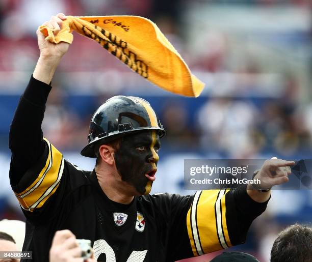 Fan of the Pittsburgh Steelers waves a terrible towel against the Arizona Cardinals during Super Bowl XLIII on February 1, 2009 at Raymond James...