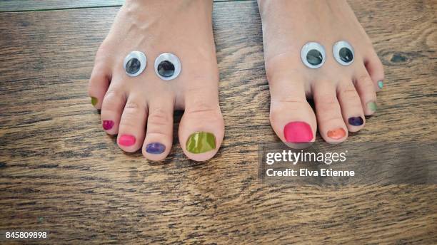 googly eyes and painted toes - toenail stock-fotos und bilder