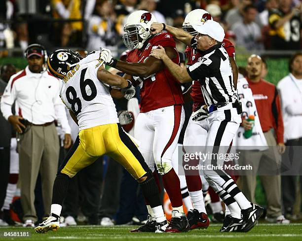 Referee Terry McAulay attempts to seperate Antonio Smith of the Arizona Cardinals and Hines Ward the Pittsburgh Steelers during Super Bowl XLIII on...