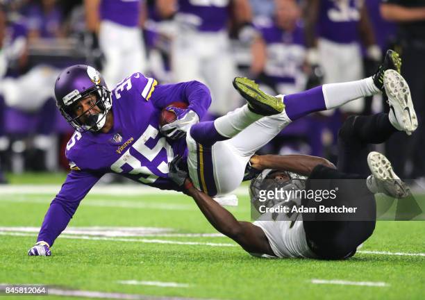 Marcus Sherels of the Minnesota Vikings is tackled with the ball in the third quarter of the game against the New Orleans Saints on September 11,...