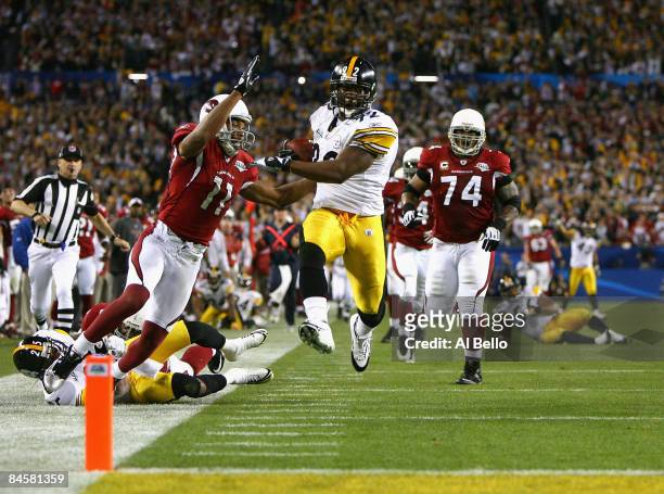 James Harrison of the Pittsburgh Steelers scores a touchdown after running back an interception for 100 yards in the second quarter against the...