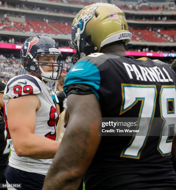 Watt of the Houston Texans shakes hands with Jermey Parnell of the Jacksonville Jaguars after the game at NRG Stadium on September 10, 2017 in...