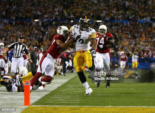 James Harrison of the Pittsburgh Steelers scores a touchdown after running back an interception for 100 yards in the second quarter against Larry...