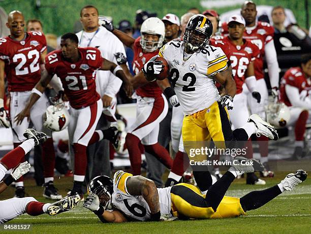 James Harrison of the Pittsburgh Steelers returns an interception 100-yards for a touchdown in the second quarter against the Arizona Cardinals...