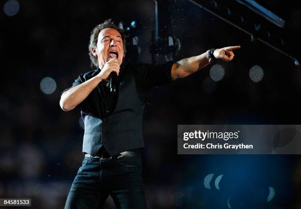 Musician Bruce Springsteen and the E Street Band perform at the Bridgestone halftime show during Super Bowl XLIII between the Arizona Cardinals and...