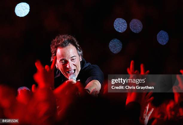 Musician Bruce Springsteen and the E Street Band perform at the Bridgestone halftime show during Super Bowl XLIII between the Arizona Cardinals and...