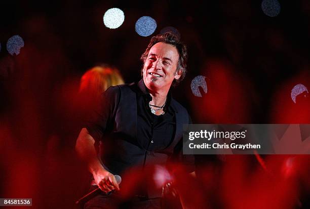 Musician Bruce Springsteen and the E Street Band perform at the Bridgestone halftime show during Super Bowl XLIII between the Arizona Cardinals and...