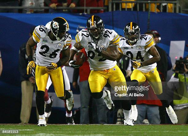 James Harrison of the Pittsburgh Steelers runs back an interception for 100 yards to score a touchdown in the second quarter against the Arizona...