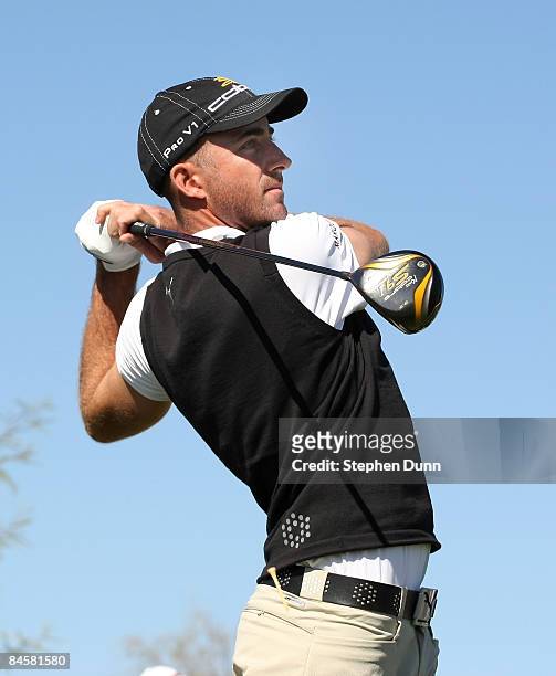 Geoff Ogilvy of Australia hits his tee shot on the ninth hole during the final round of the FBR Open on February 1, 2009 at TPC Scottsdale in...