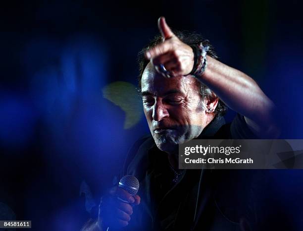 Musician Bruce Springsteen and the E Street Band perform at the Bridgestone halftime show during Super Bowl XLIII between the Arizona Cardinals and...