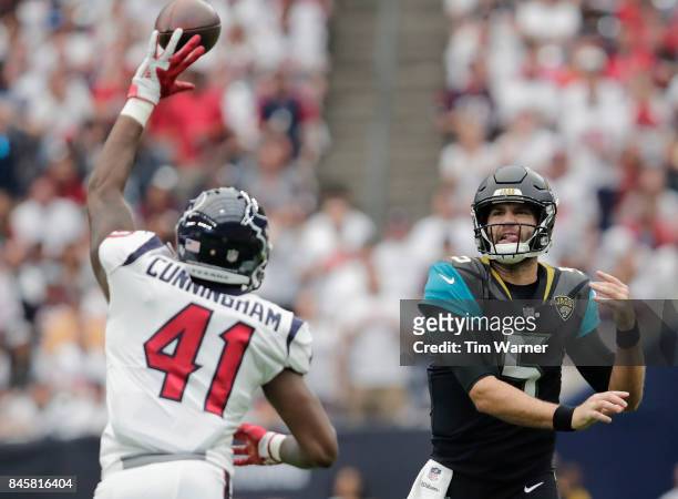Zach Cunningham of the Houston Texans tips a pass by Blake Bortles of the Jacksonville Jaguars in the first quarter at NRG Stadium on September 10,...